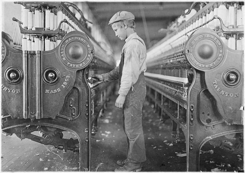 A young boy working in a mill