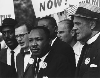 Image of Dr. Martin Luther King addressing a rally