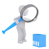 Person holding magnifying glass over binders