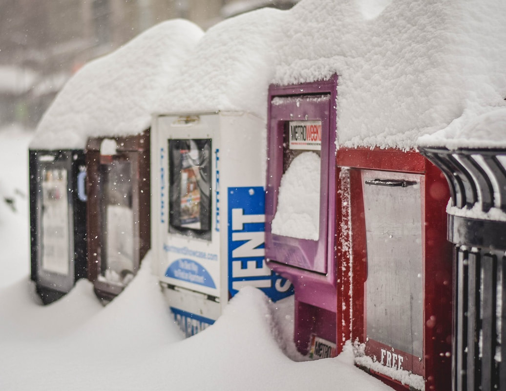Snow-covered vending machines