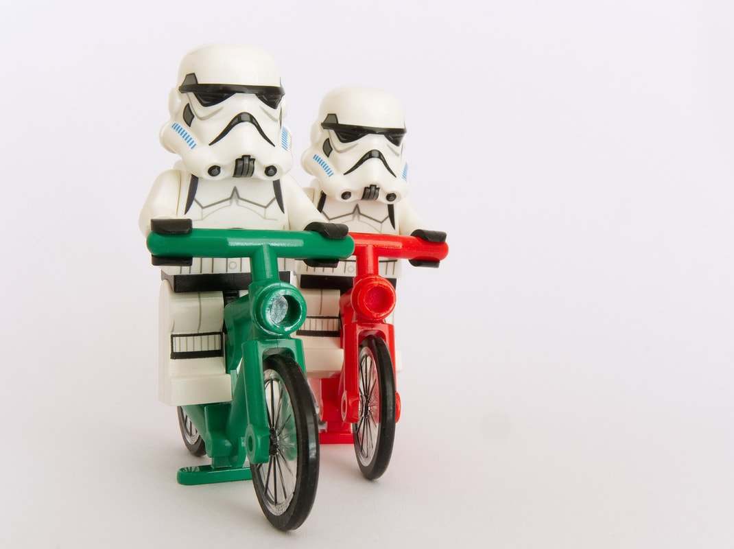 Lego stormtroopers riding bikes